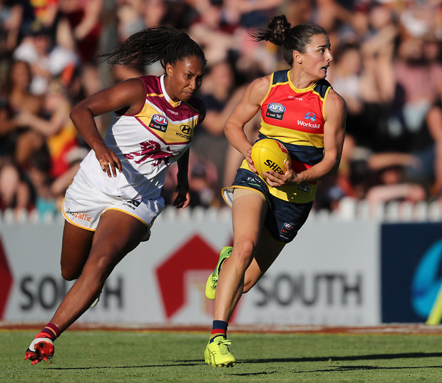 brisbane lions women's team playing with austraffic sponsored shorts